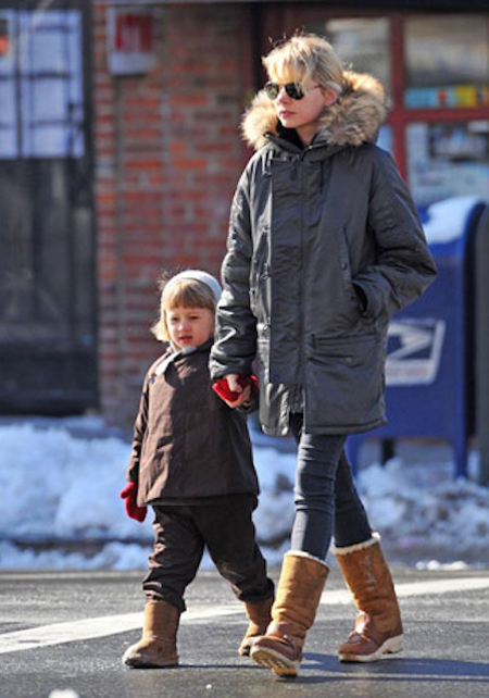 Wearing matching boots, Michelle Williams takes her waltzing Mathilda out for some fun in the snow