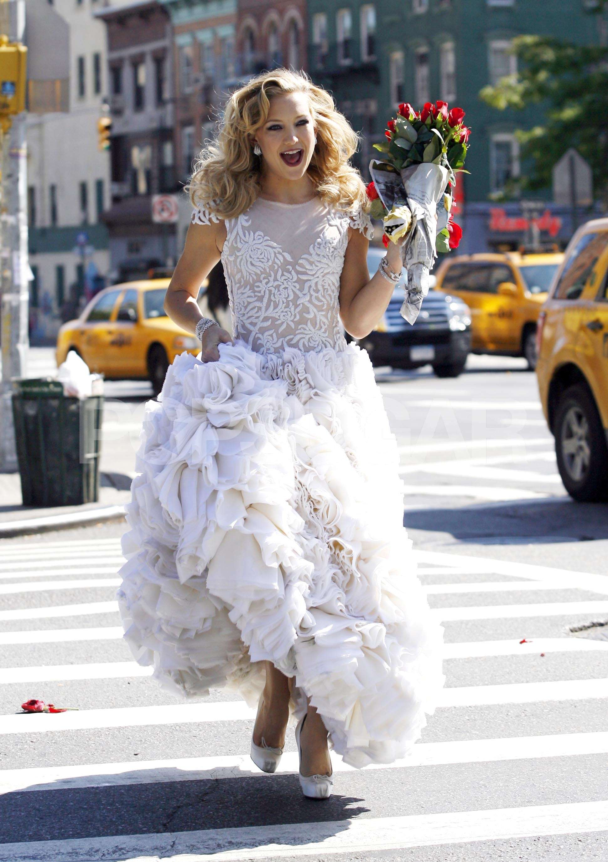 ©2009 RAMEY PHOTO 310-828-3445 Kate Hudson crosses Avenue A near Houston Street wearing a wedding dress during a photo shot for Harper's Bazaar magazine on October 6, 2009 SPNY