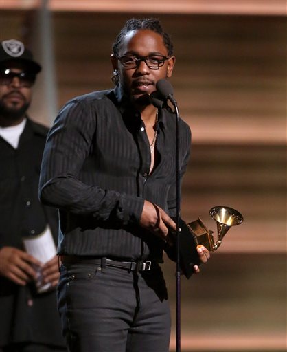 Kendrick Lamar accepts the award for best rap album for To Pimp A Butterfly at the 58th annual Grammy Awards on Monday, Feb. 15, 2016, in Los Angeles. (Photo by Matt Sayles/Invision/AP)
