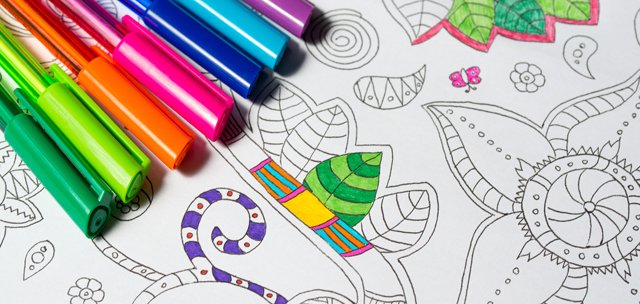 Coloring book for adults with abstract patterns and colored pens, antistress painting