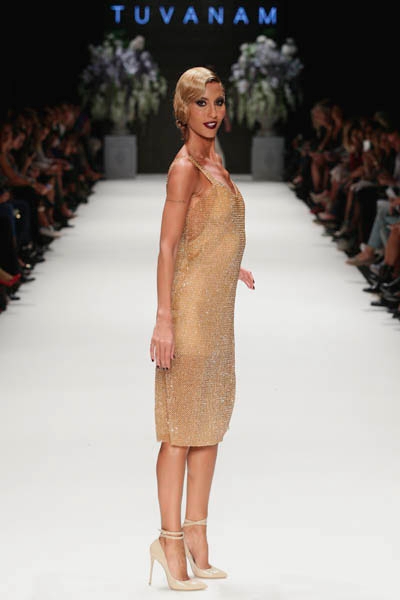 ISTANBUL, TURKEY - OCTOBER 09: A model walks the runway at the Tuvanam show during Mercedes-Benz Fashion Week Istanbul s/s 2014 presented by American Express on October 9, 2013 in Istanbul, Turkey. (Photo by Vittorio Zunino Celotto/Getty Images for IMG)