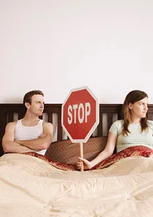 couple fighting stop sign